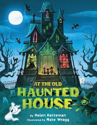 Three trick-or-treaters stand at the door of a house with witches, vampires, and monsters in its windows. A witch chases a ghost through the graveyard in front of the house. Text: "At the Old Haunted House By Helen Ketteman Illustrated by Nate Wragg."