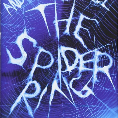 A white spider's web sits in front of a blue and black background, with a black spider on the bottom right. The web spells out the text: "Andrew Harwell. The Spider Ring."