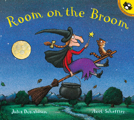 A smiling witch with white skin holds a wand and a cauldron. She wears a black hat and cape, a red shirt, and a purple skirt. A smiling orange and black cat rides in front of her. The background is green woods, a blue night sky, and a yellow moon. Text: "Room on the Broom. Julia Donaldson. Axel Scheffler."